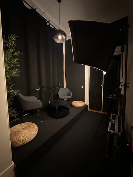 Full studio setup with lighting and seating