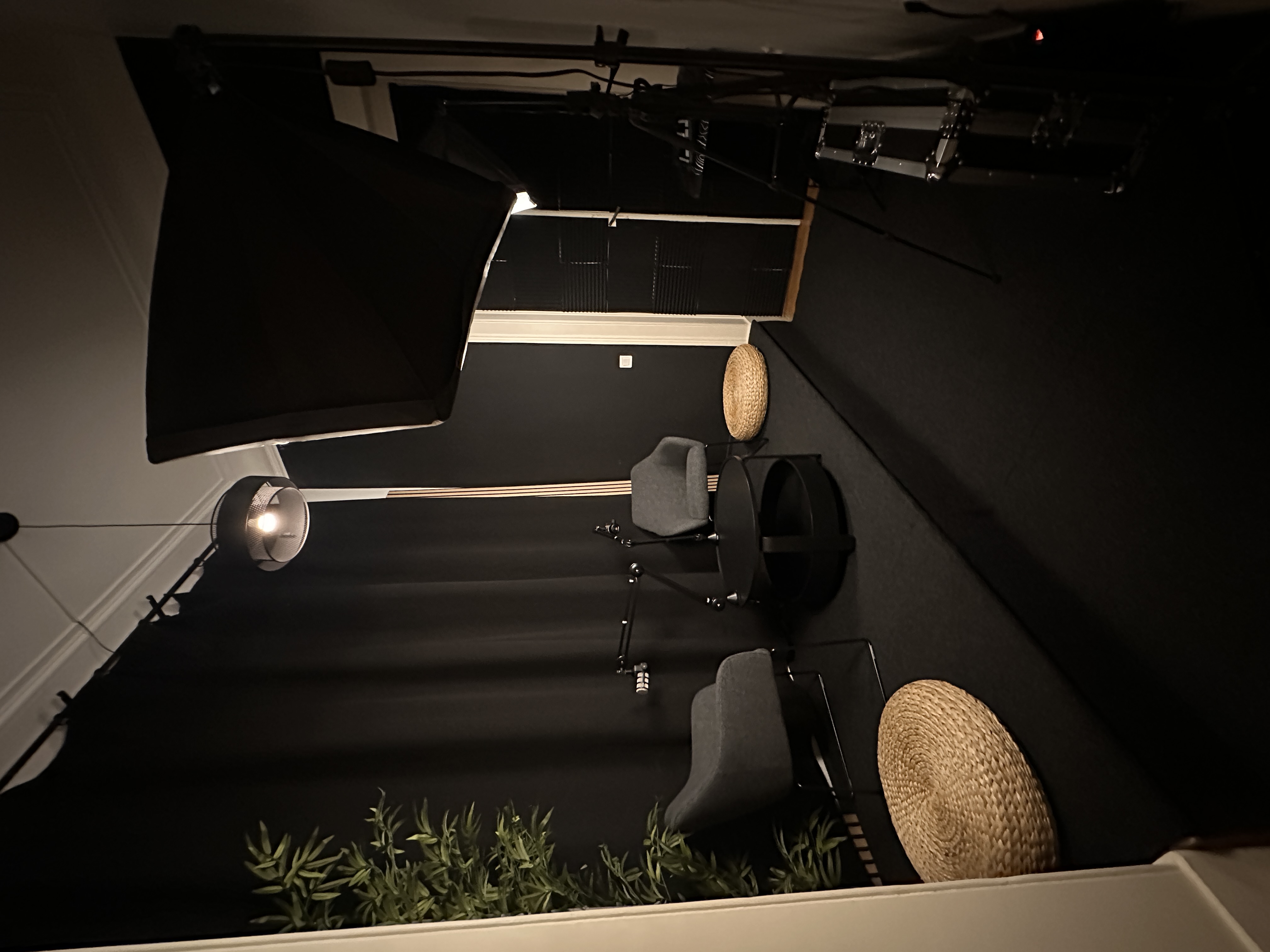 Wide view of the podcast studio seating and lighting at Red Panda Studio
